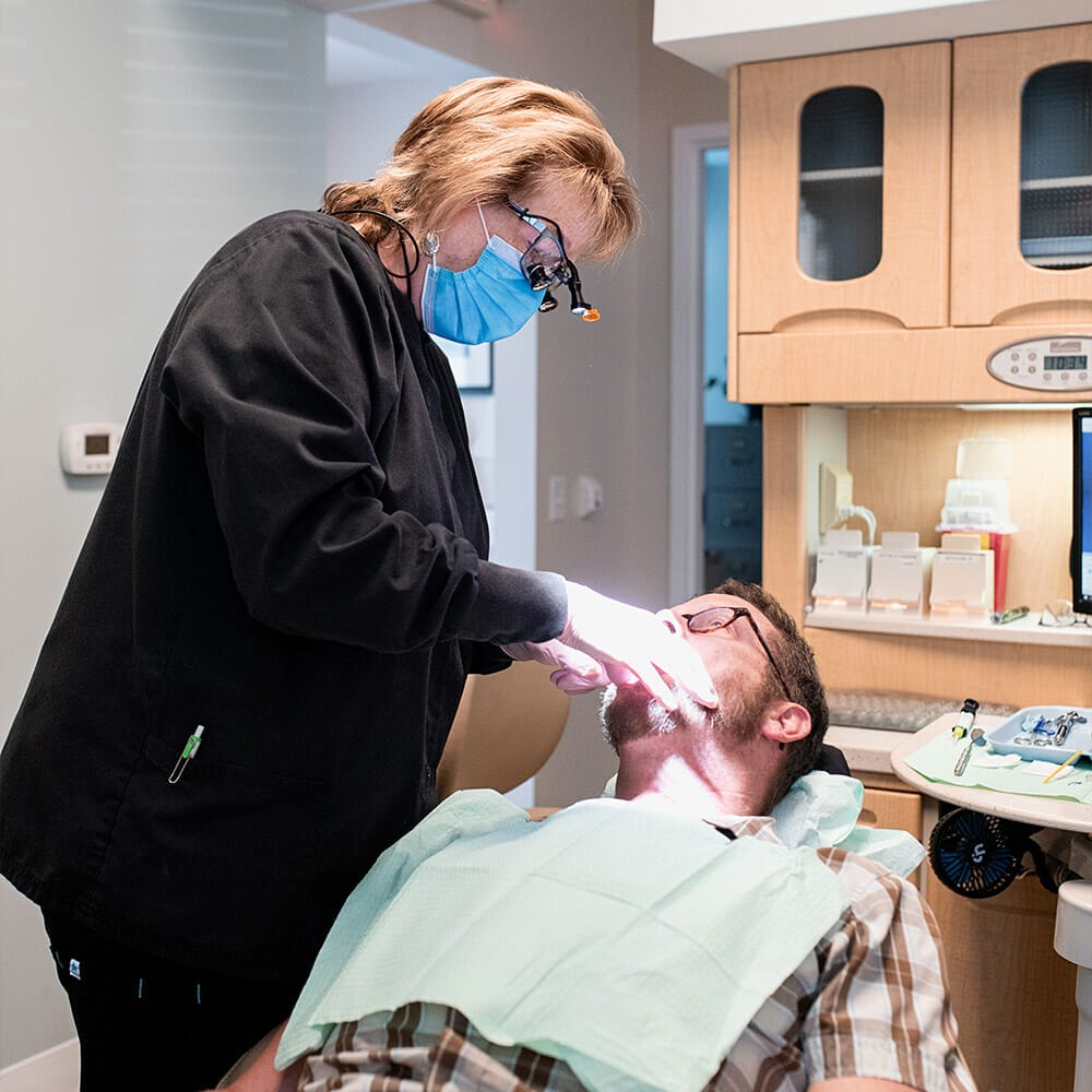 patient in chair getting dental exam in Delaware ohio