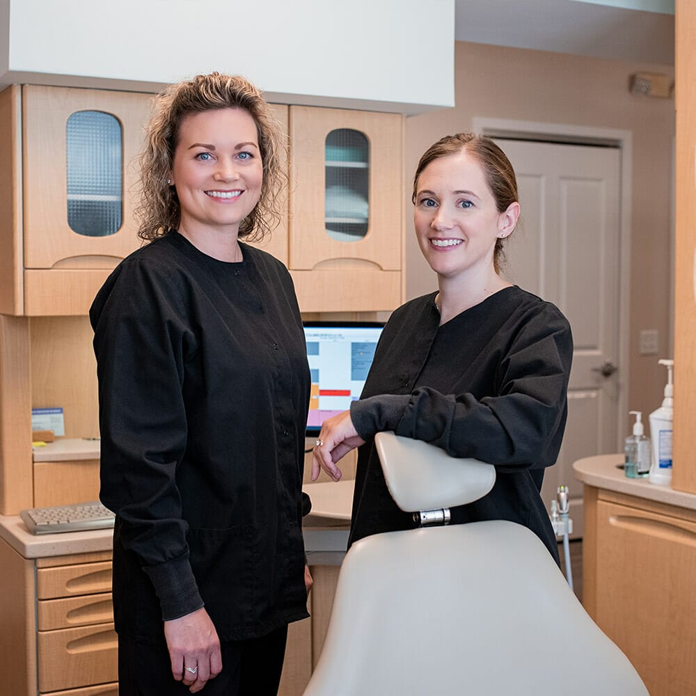 The Eric Batterton, DDS team in patient room smiling